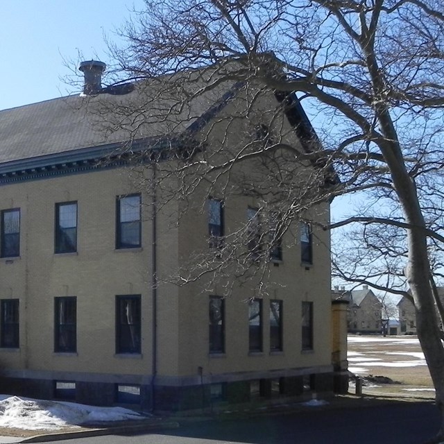 a tan barracks building