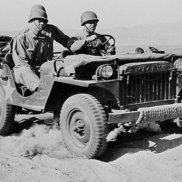men in a jeep in the mojave desert