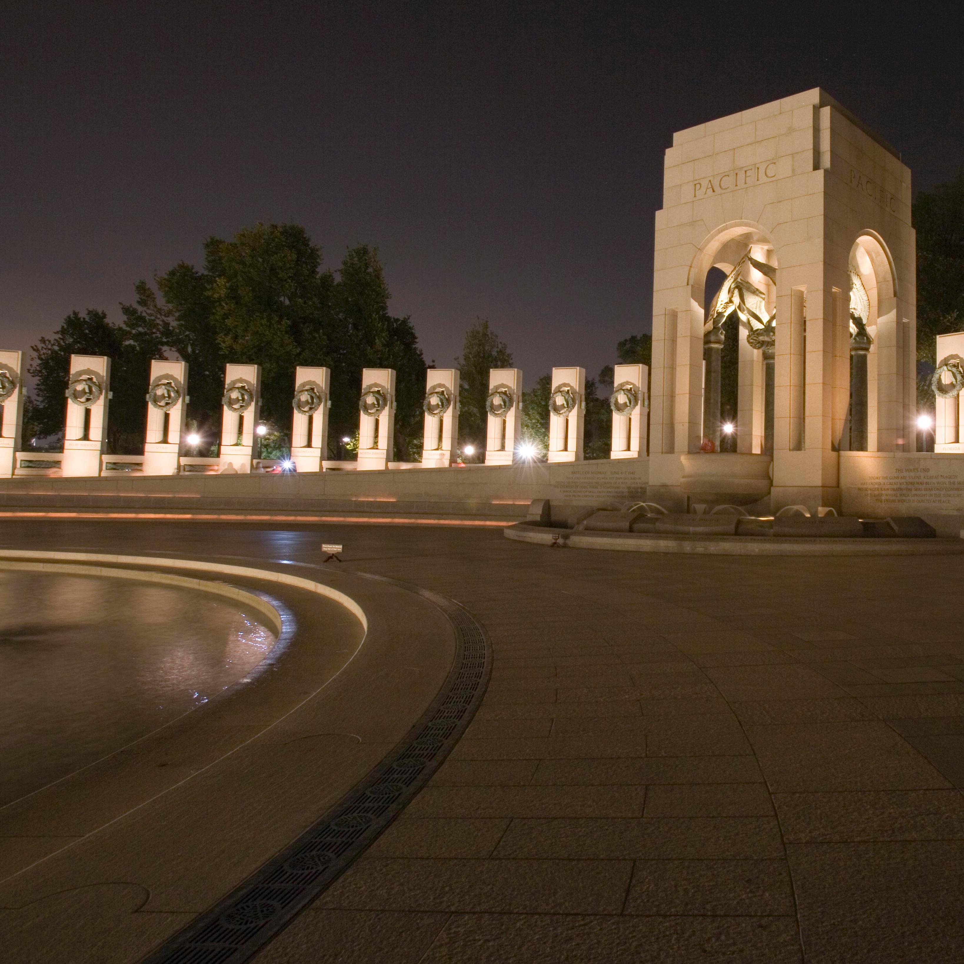 nighttime view of memorial with fountains