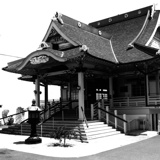 A building with steep roofs and decorative statuary