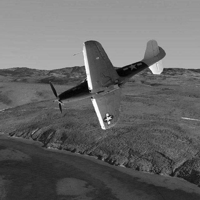WWII airplane over Point Reyes