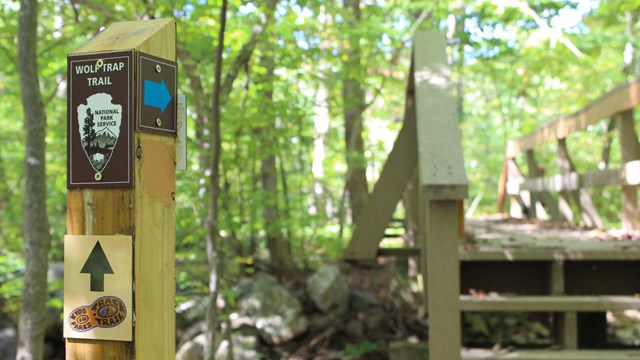 Trail post next to a bridge