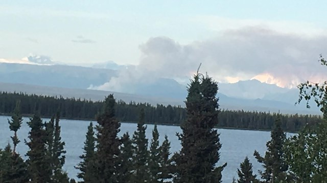 smoke from fire at base of Wrangell Mountains