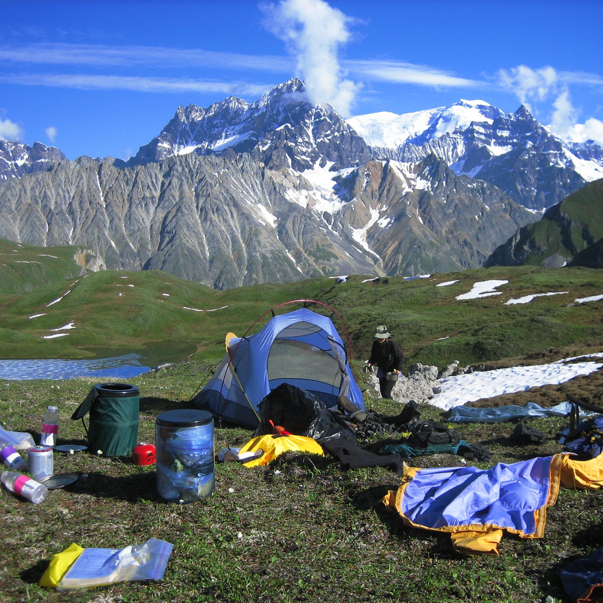 Scenic mountain view from a campsite with a blue sky