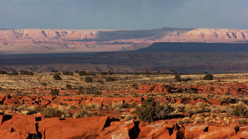 light and shadows provide striking contrast among colorful desert mesas