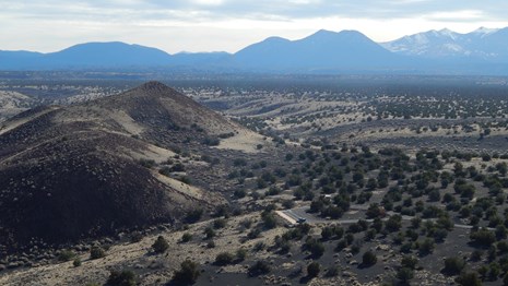 View of The Doney Picnic area and trail from above with other cinder cones in the background. 
