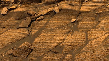 View of the "Burns Cliff" on Mars showing rock layers with evidence of water reactions.