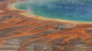 The rainbow colors of Grand Prismatic Spring range from blue to orange.