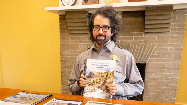 Ranger holds a copy of the Resources & Issues publication