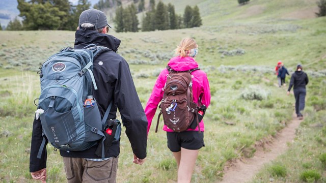 Photo of hikers with bear spay