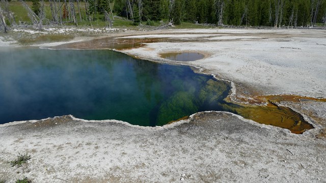 A deep, blue and green hot spring.