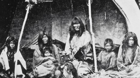 A family seen sitting in the shelter.