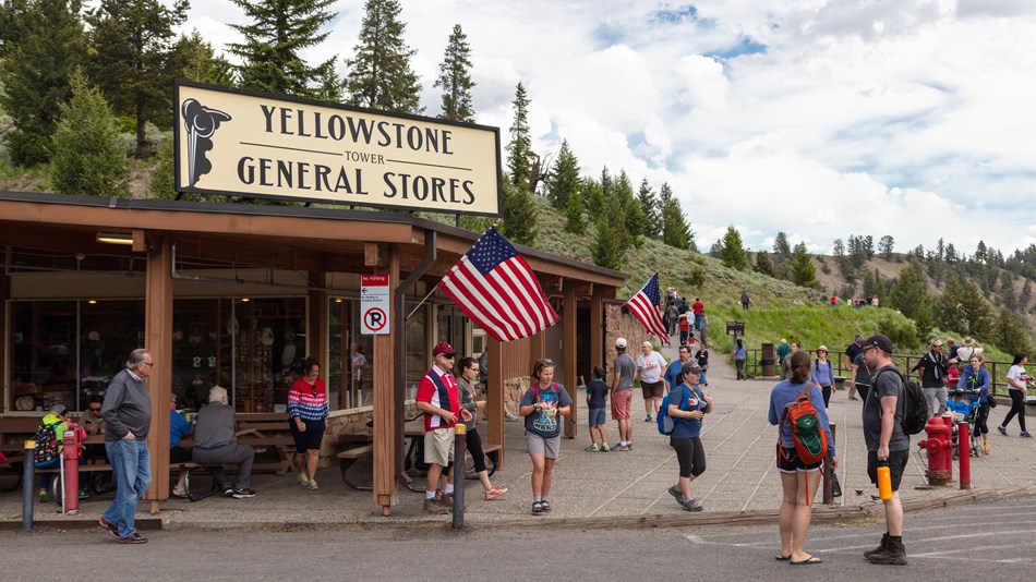 A group of people in front of the Tower Fall store in Yellowstone