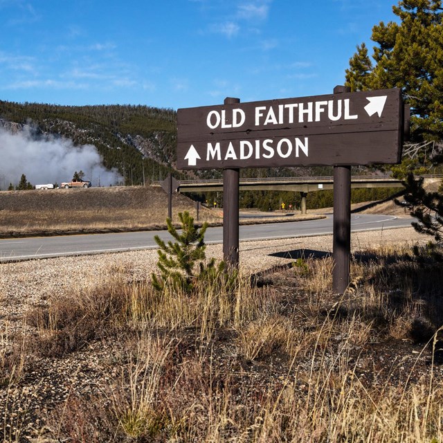 a park road sign that reads: 