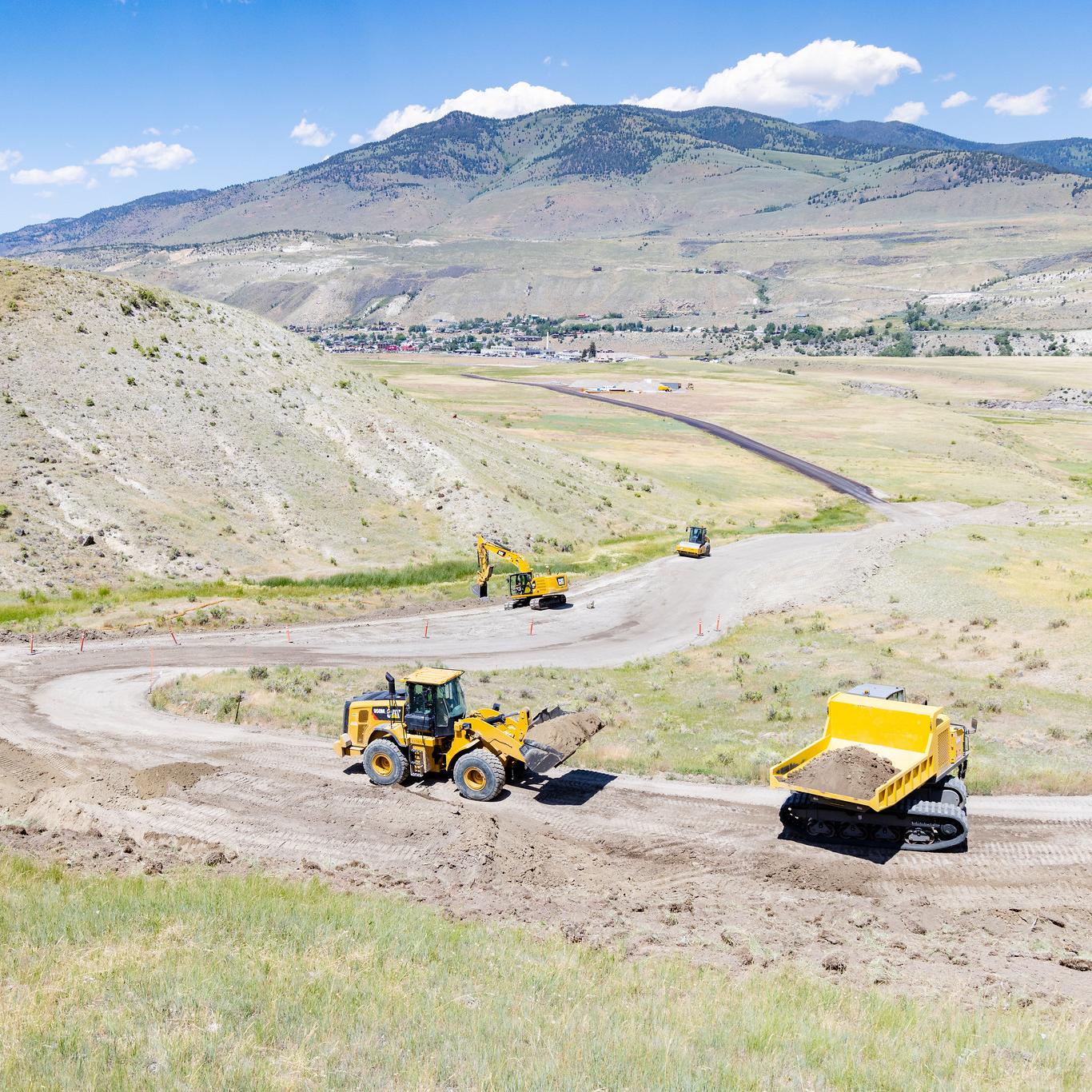 Large construction machinery working on a dirt road
