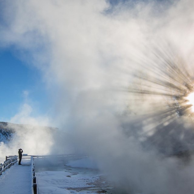 Photo of someone photographing steam at Dryad Spring