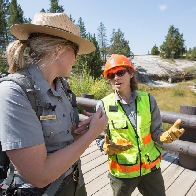 Photo of rangers near Old Faithful