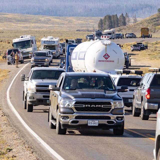 A fuel truck in a traffic jam.