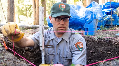 Archeologist Tom James surveying an archeological site.