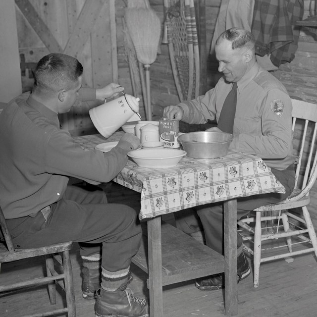 Park Rangers Breakfasting in Backcountry Cabin