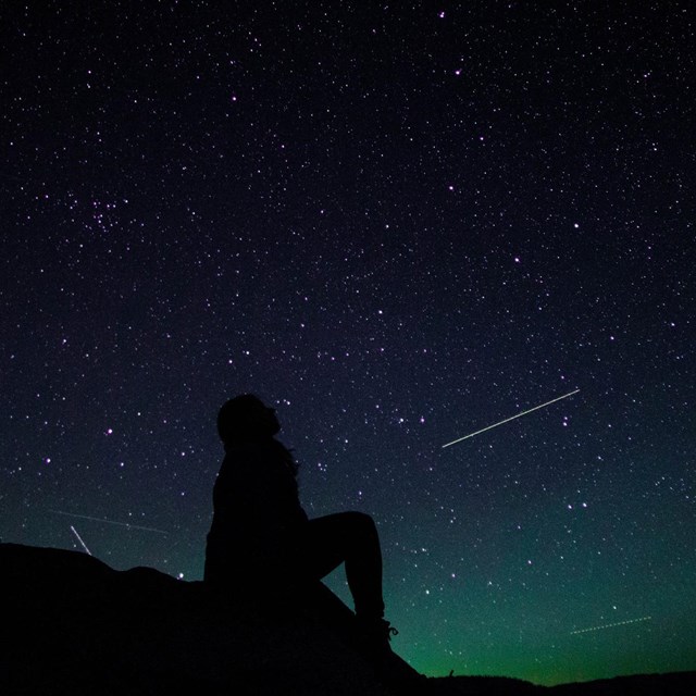 Person looking at night sky at Glacier Point