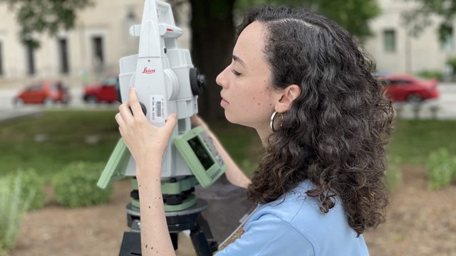 woman working on a laser scanner