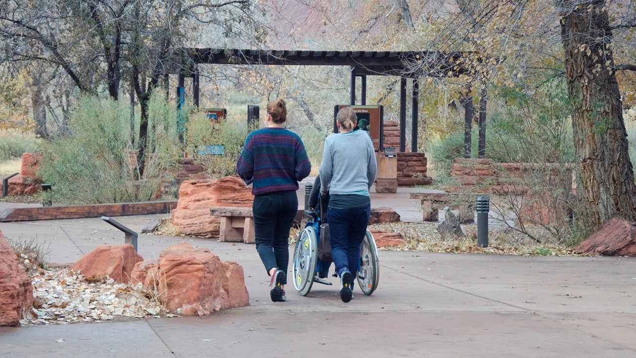 Person using wheelchair near Zion Canyon Visitor Center.