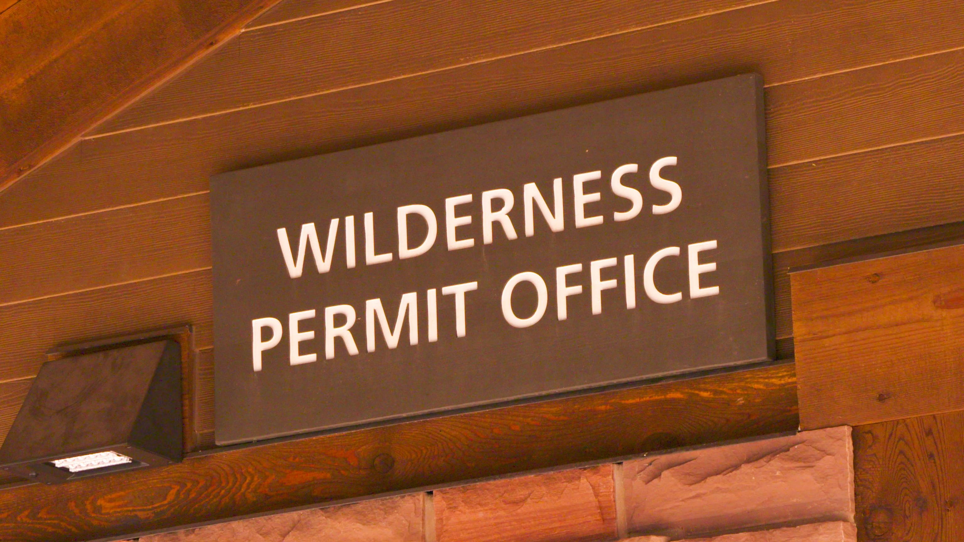 A wooden sign reading 