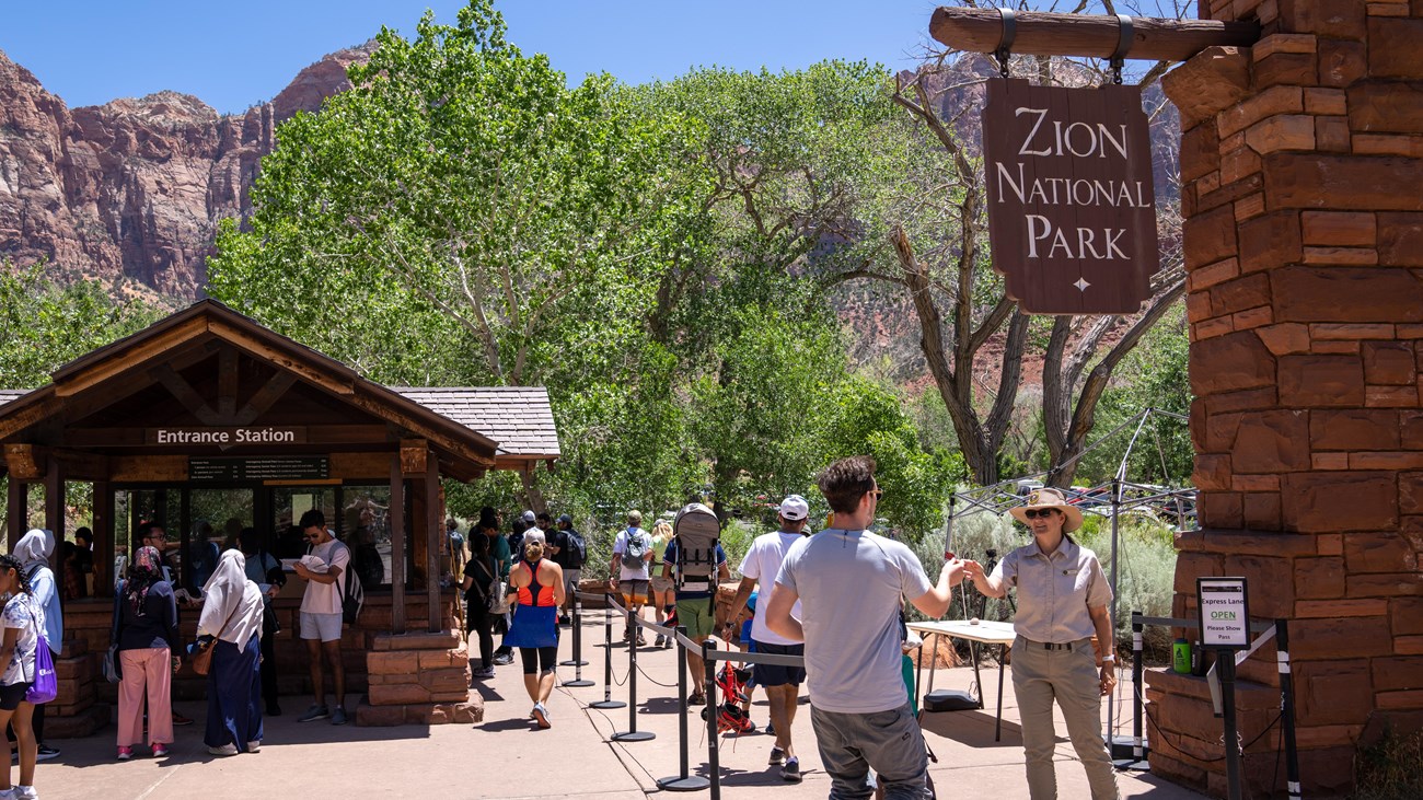 Visitors walk through the pedestrian entrance near the Virgin River.