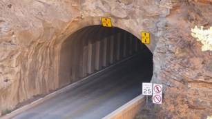 A tunnel opens on to a bridge.