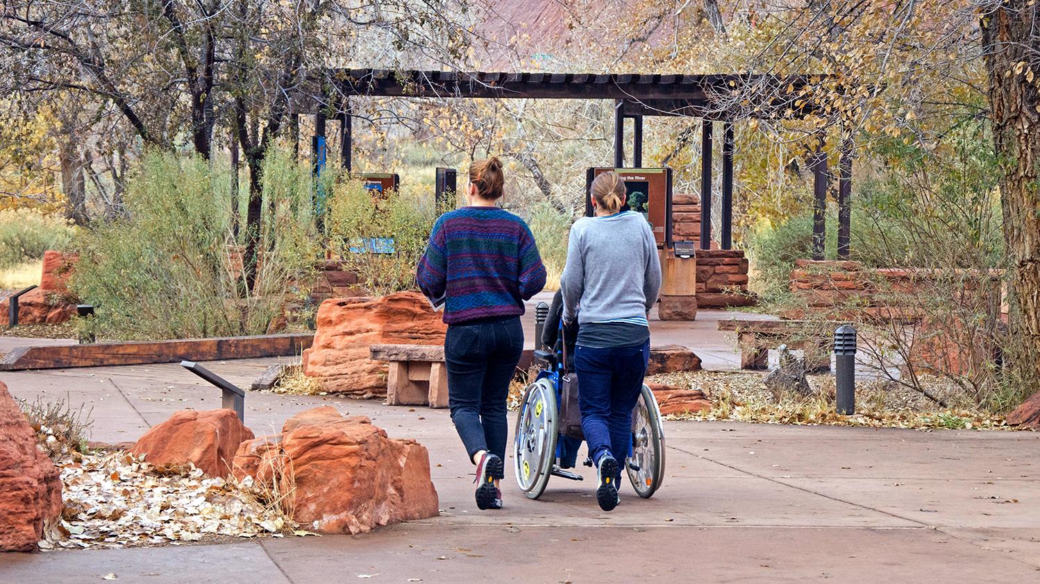 A person uses a wheelchair near Zion Canyon Visitor Center.