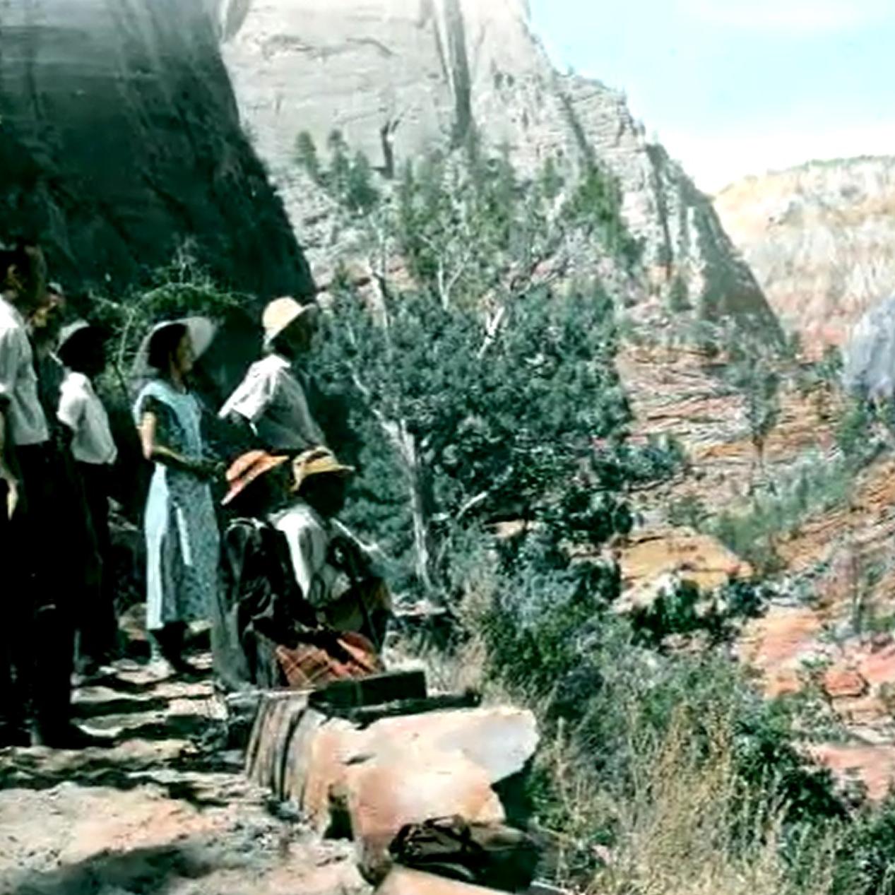 Visitors stop at a viewpoint along the East Rim Trail overlooking Zion Canyon.