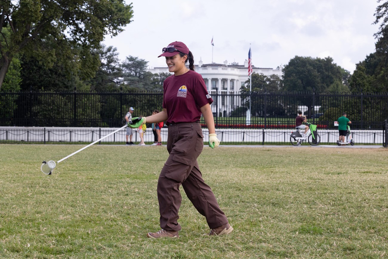 Traditional Trades Advancement Program (TTAP) intern Kendall Soriano removes trash near the White House in Washington, July 22, 2025.