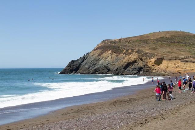 People walk on a beach