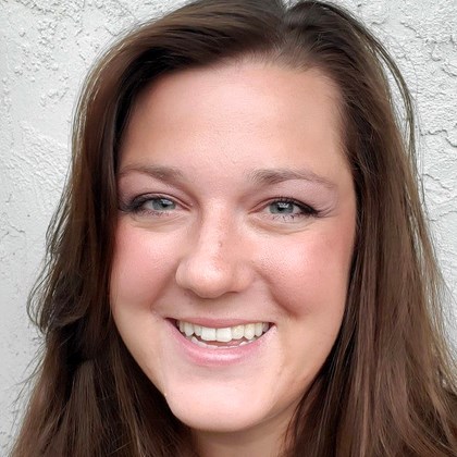 Face of smiling woman with brown hair