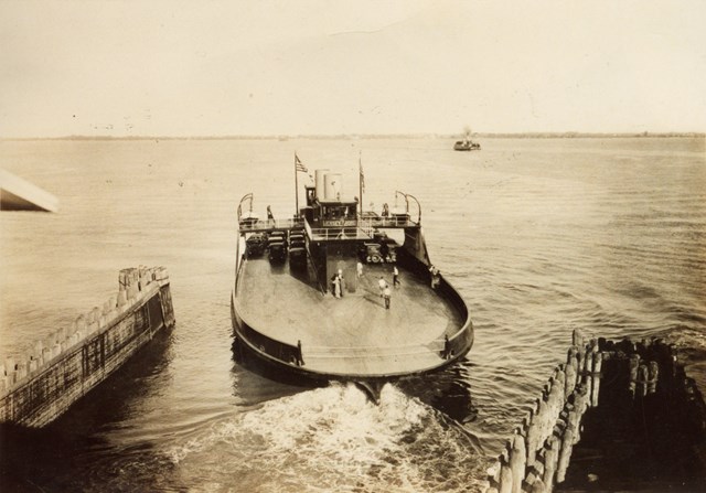 Ferry on the water leaving a dock.