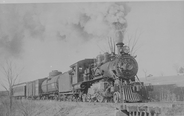 A black and white photo of a train.