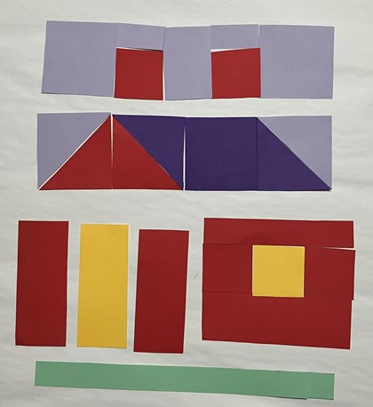 Paper laid out to form parts of a quilt block in the shape of a house, paper in sections