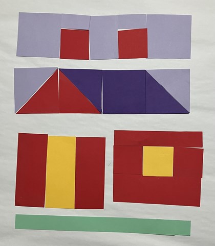 Paper laid out to form parts of a quilt block in the shape of a house, rows together. 