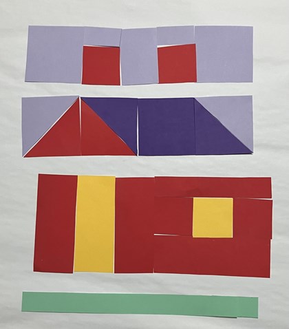Paper laid out to form parts of a quilt block in the shape of a house, rows together and two big blocks. 