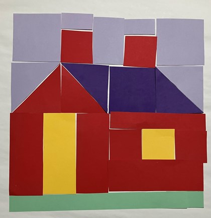 Paper placed together to form a quilt block in the shape of a house. 