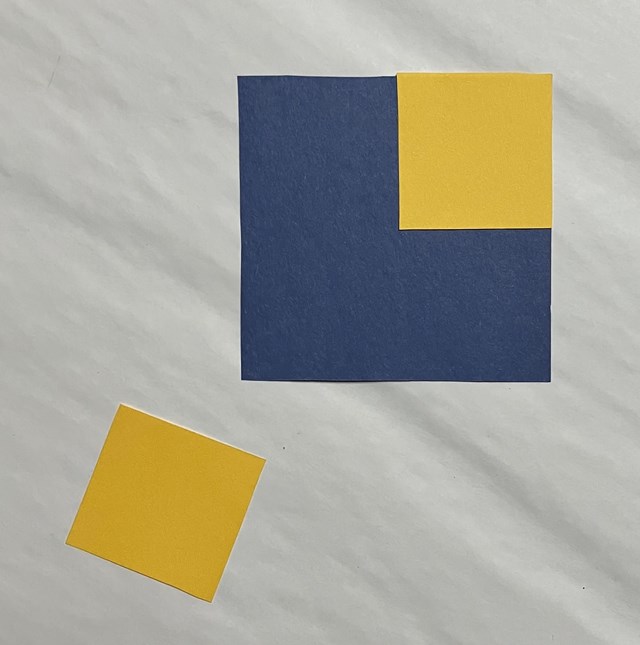 3 square in a diagonal row. One large blue square and 2 yellow squares. One yellow square on blue square.