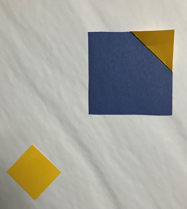  One large blue square and 1 yellow square. One yellow triangle in the corner. 