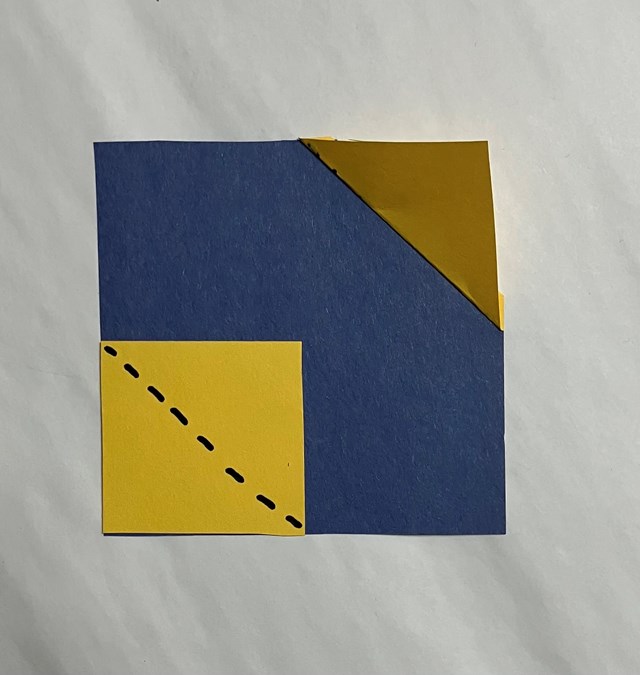 A blue square with a triangle yellow corner to bottom yellow square.