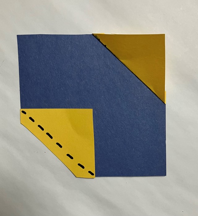 A blue square with a triangle yellow corner to bottom yellow square. A dashed line on bottom corner.
