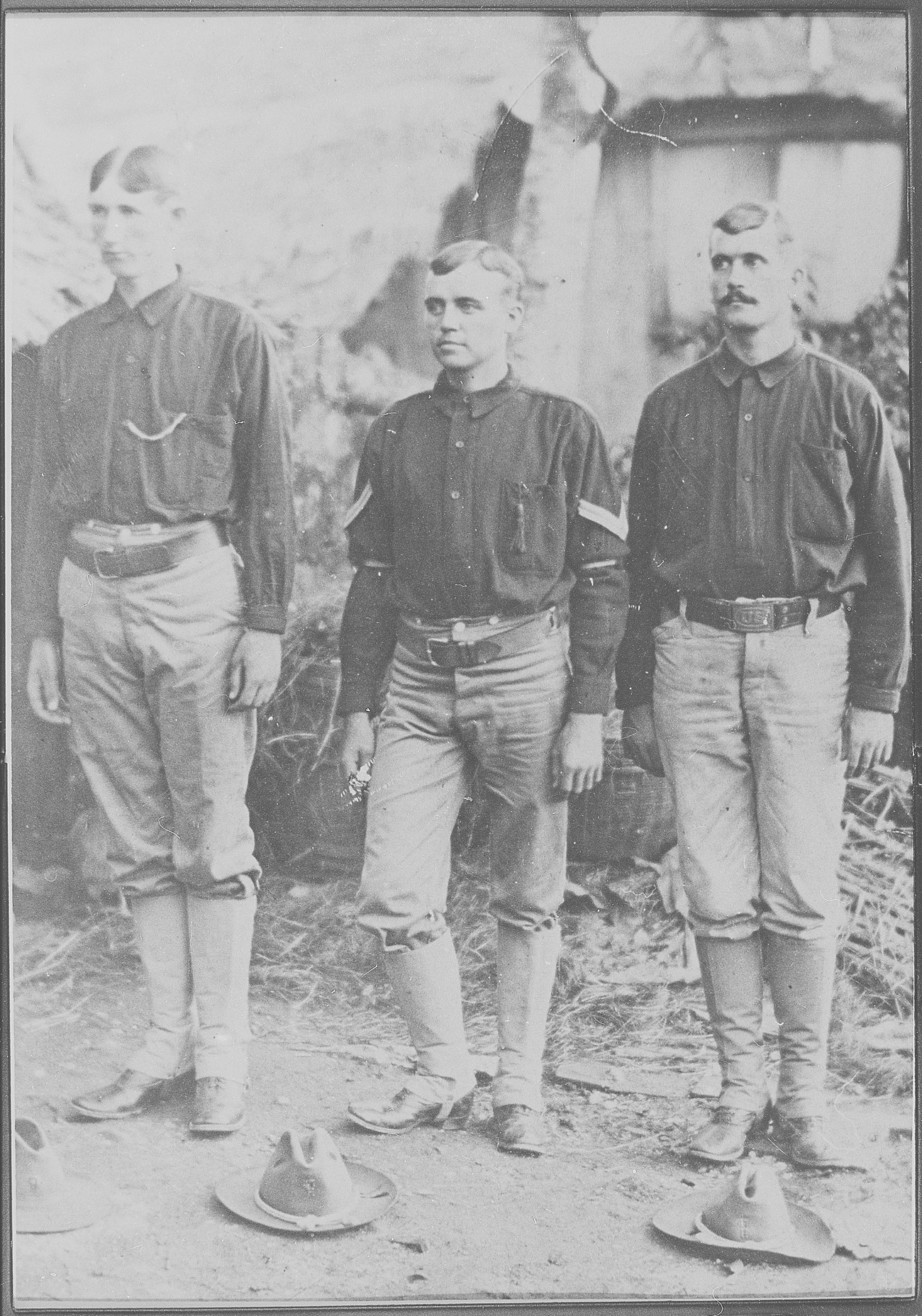 A group of men standing in uniform.