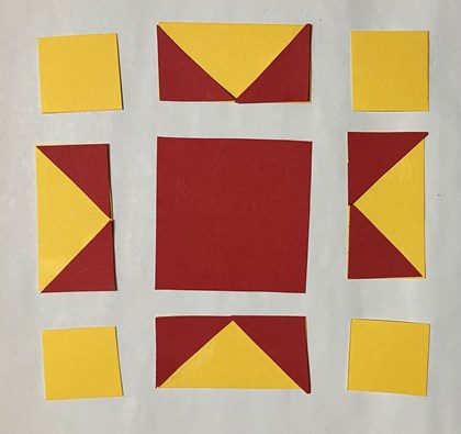 A large red square in the middle of yellow and red rectangles and yellow squares.