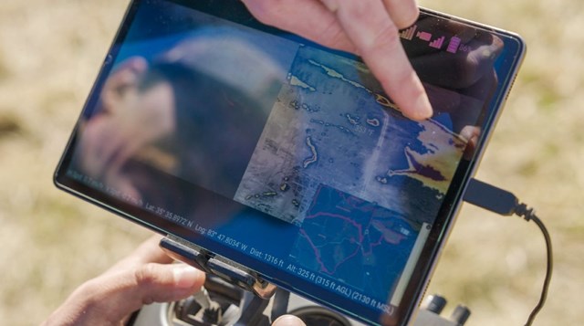 Tablet showing a live fire map of a prescribed fire.