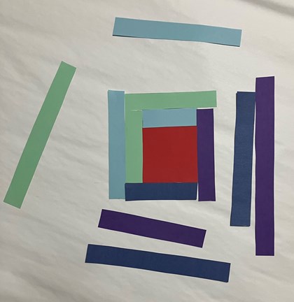 Strips of paper of different colors and sizes around a square.