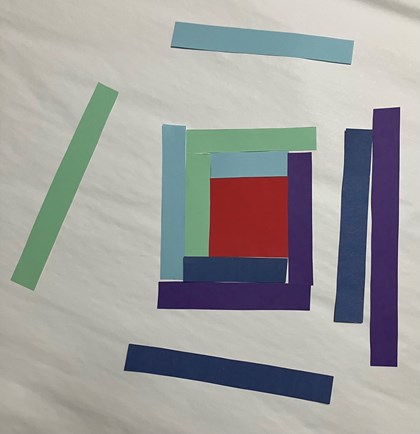 Strips of paper of different colors and sizes around a square.
